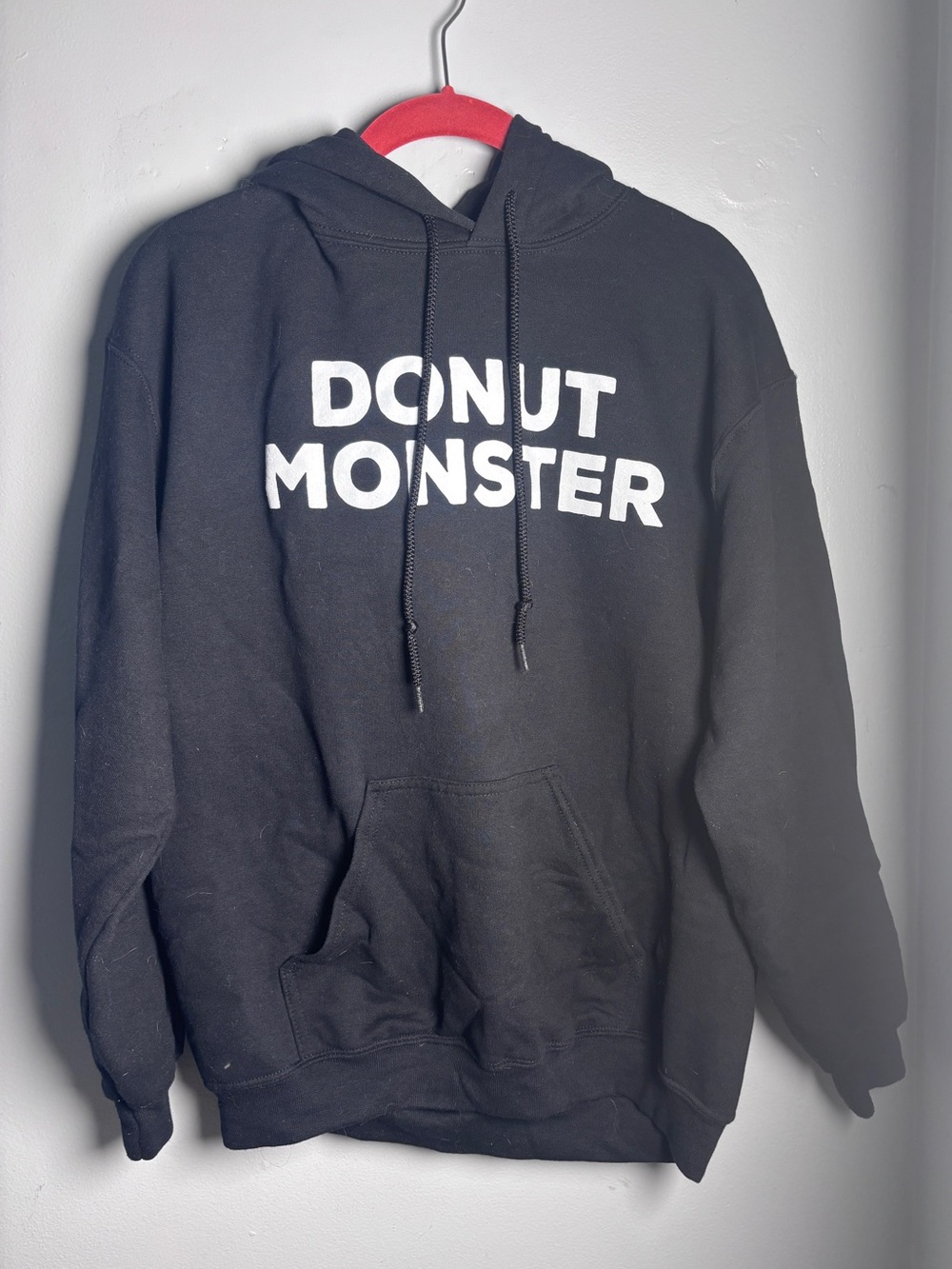 Women’s black hoodie “donut monster” size M